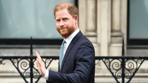 Prince Harry waves as he leaves the High Court in London, April 8, 2025 (Getty Images).