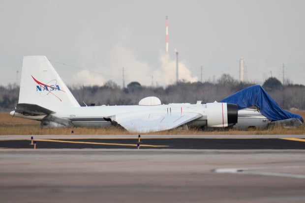 NASA WB-57 rests on the Ellington Airport runway after a gear-up belly landing on Jan. 27, 2026, in Houston.