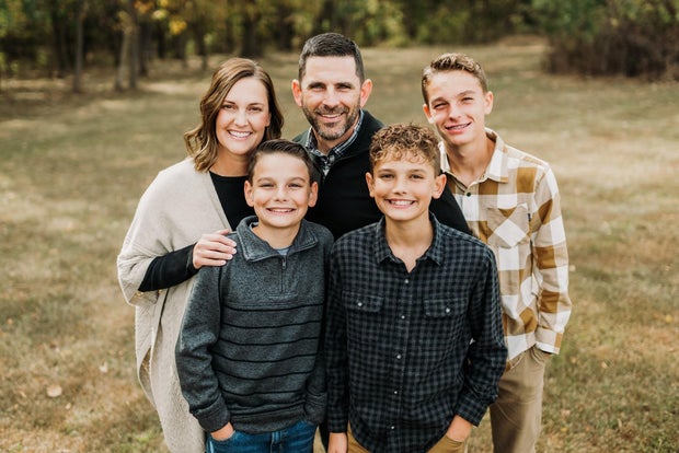 Heidi and Kenton Snyder with their three sons; the Illinois family is adopting a girl from Cote d'Ivoire.