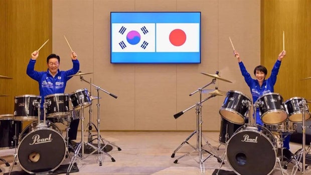 South Korea's President Lee Jae-myung and Japan's Prime Minister Sanae Takaichi play drum kits together in Nara after their summit.