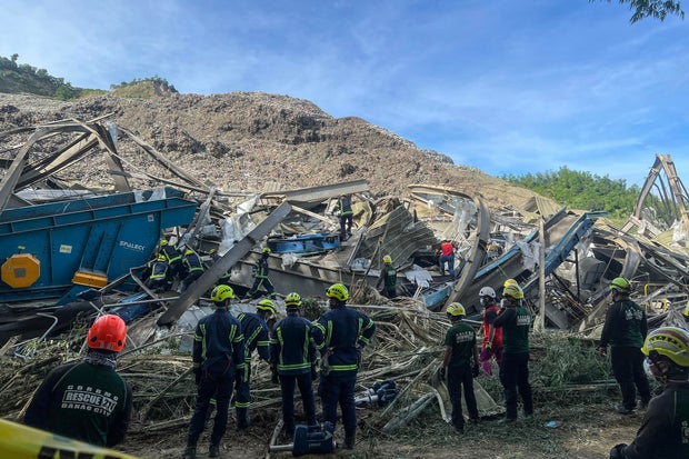Search and rescue teams look for people after a landslide at a landfill in Cebu City, Philippines, on Jan. 9, 2026.