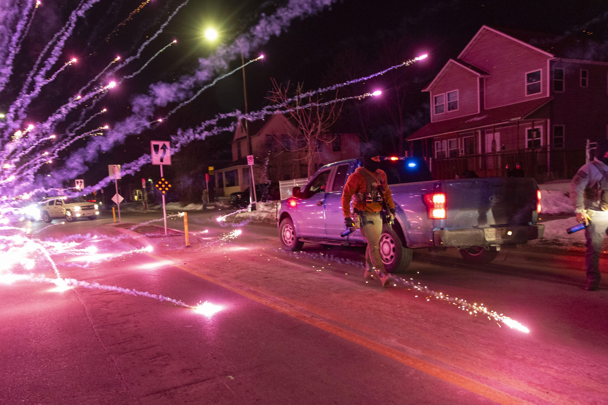 Federal agents use crowd-control measures during protests in north Minneapolis on Jan. 14, 2026.