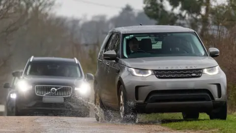 Vehicles, believed to be police, near Mountbatten-Windsor's Sandringham residence on Thursday morning.