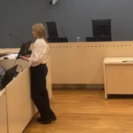 State prosecutor Sturla Henriksb (L) read out the 38 charges as the trial got under way - bbc