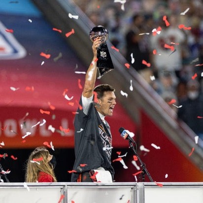 Tom Brady and his daughter Vivian celebrating during the award ceremony for Super Bowl LV at Raymond James Stadium on Feb. 7, 2021 in Tampa, Florida. The Tampa Bay Buccaneers defeated the Kansas City Chiefs 31-9. - cbs