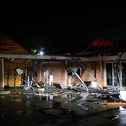 Workers secure the Fifth Third Bank after it was damaged by a tornado on Feb. 19, 2026, in Bloomington, Indiana. Jeremy Hogan/Getty Images - Jeremy Hogan/Getty Images