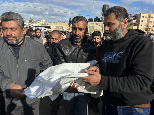 Relatives carry bodies from the morgue of Nasser Hospital in Khan Younis for funeral processions amid a ceasefire, Feb. 4, 2026.