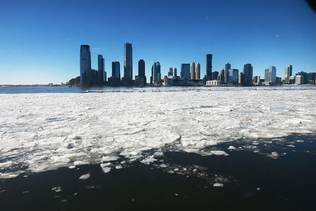 Ice floes along Manhattan's Hudson River during frigid post-storm temperatures.