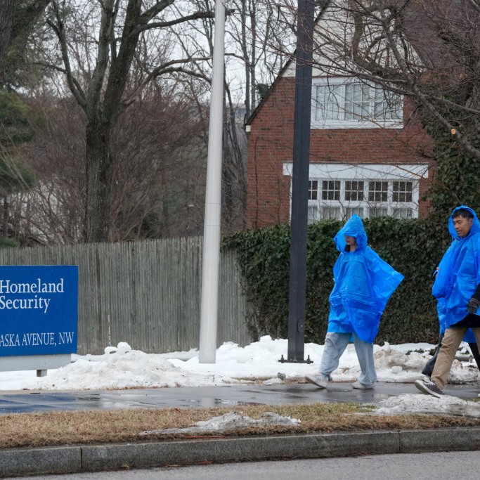 Left: People walk near the entrance to US Homeland Security Department on Nebraska Avenue in Washington, D.C., U.S. February 15, 2026. REUTERS/Ken Cedeno - pbs