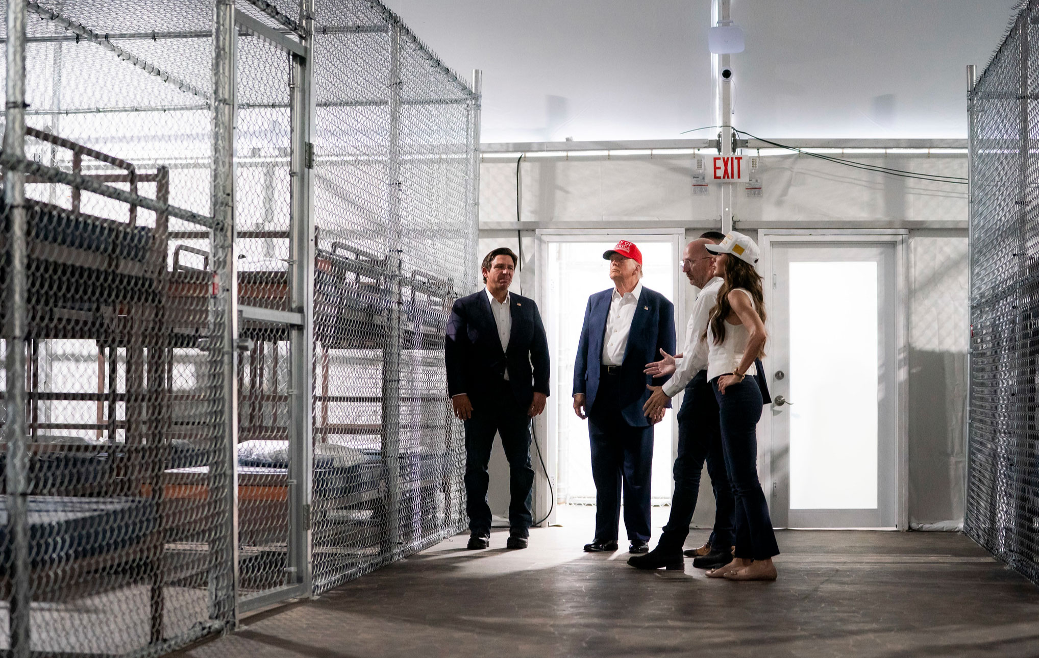 A tour of a detention-style facility, illustrating DHS enforcement operations under discussion.