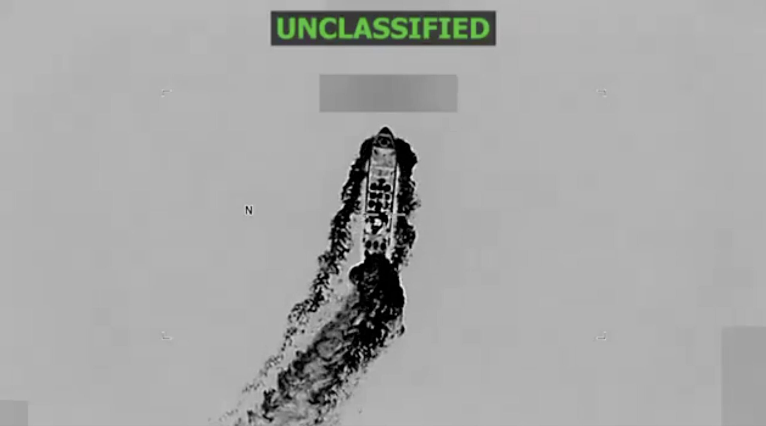 Aerial infrared view of a small boat at sea, similar to craft used in smuggling off Puerto Rico