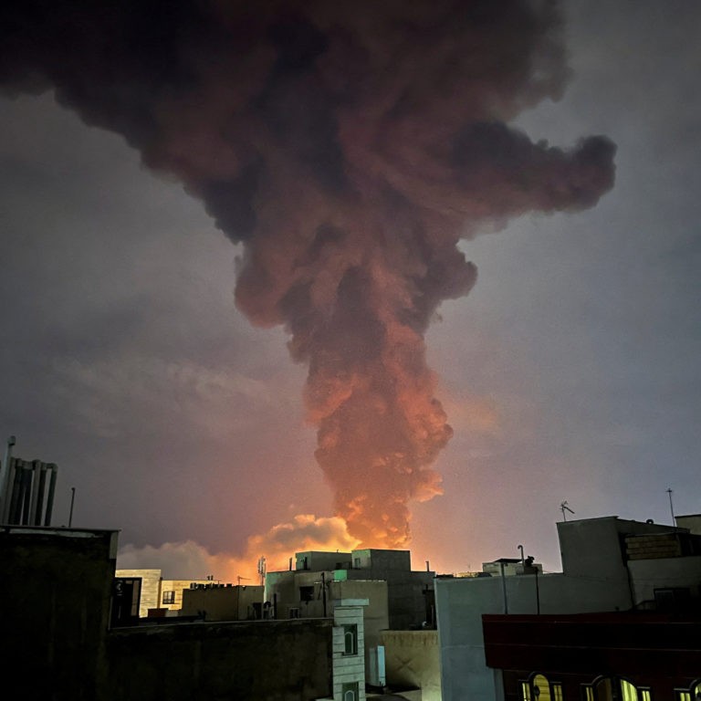 Smoke rises following an explosion, an banner in Tehran - Majid Asgaripour/WANA (West Asia News Agency) via Reuters