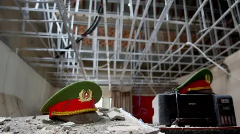 Vietnamese police caps left behind in a themed room at the Royal Hill complex