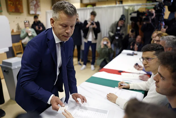 Peter Magyar, leader of the TISZA party, prepares to vote at a polling station during Hungary's parliamentary elections in Budapest on April 12, 2026.