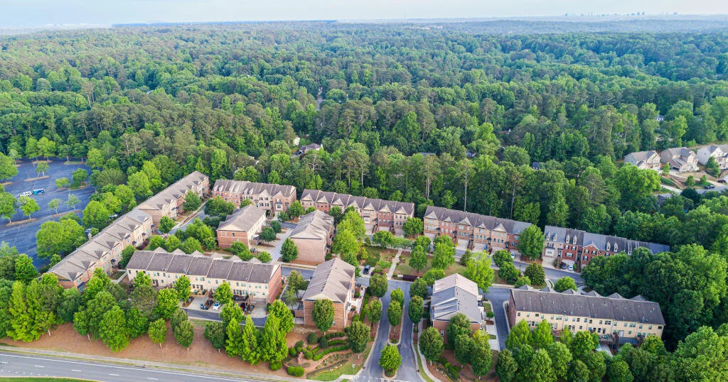 Aerial view of an upscale suburban housing development representing upper-middle-class neighborhoods.