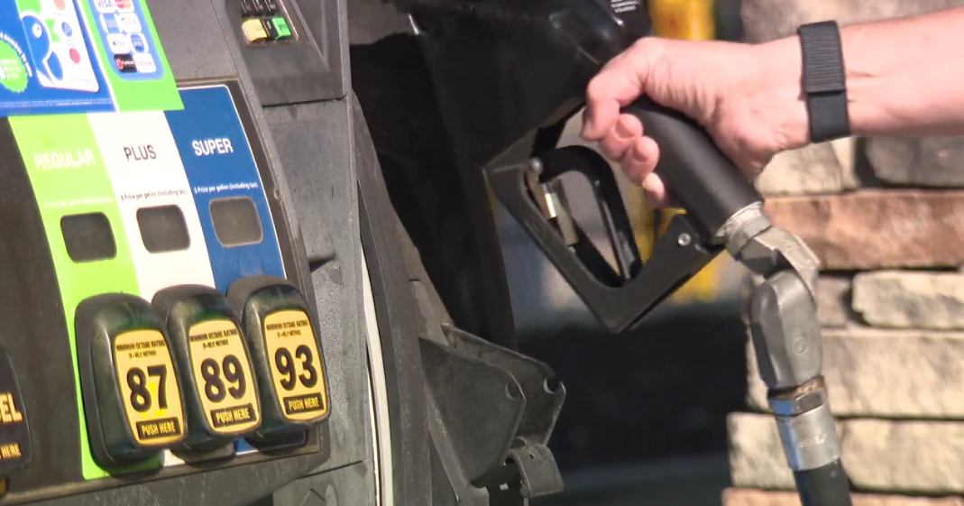 Driver fueling a car at a gas station as U.S. gasoline prices top $4 per gallon.