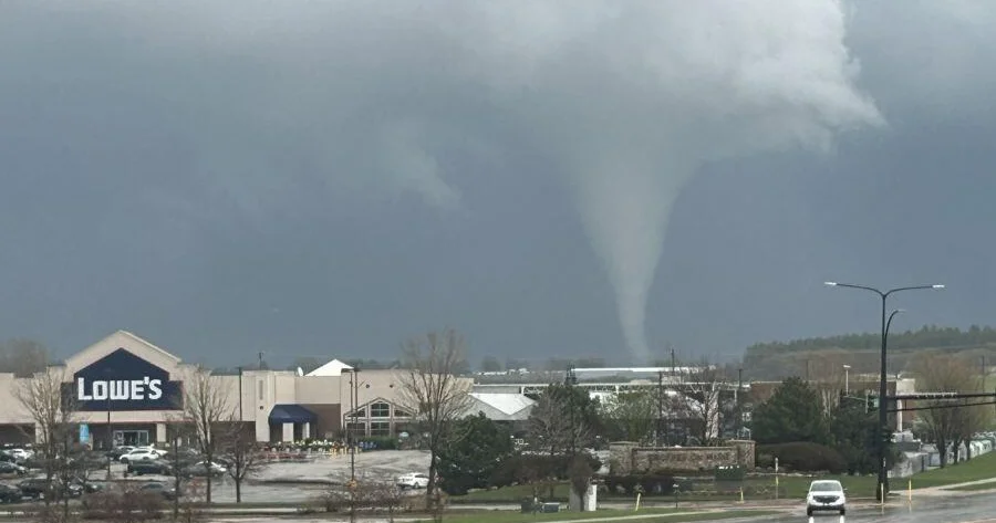 Tornado funnel over a commercial area during Friday's outbreak in the Upper Midwest, April 17, 2026.