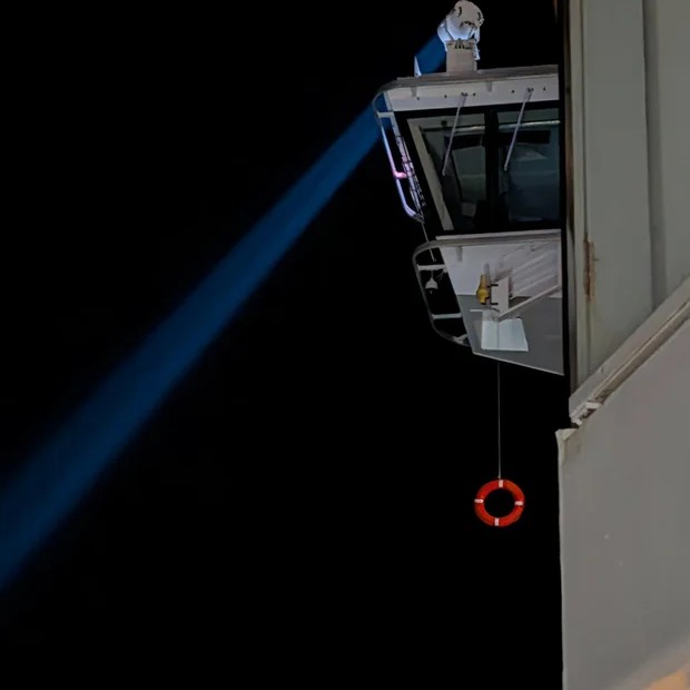 A spotlight and life ring after a crew member fell overboard off the Norwegian Breakaway. - Zac Chupka