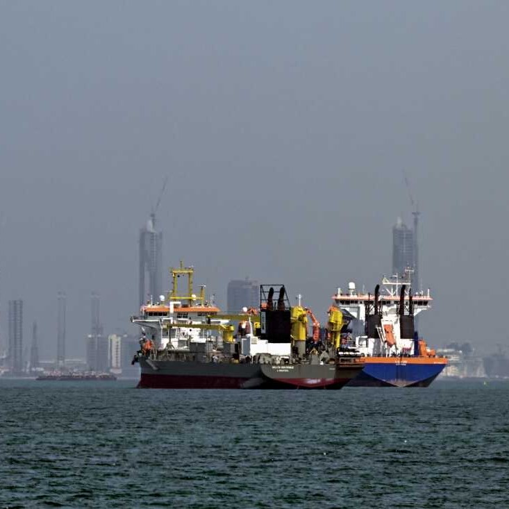 Commercial vessels offshore in Dubai, United Arab Emirates, on March 11. Attacks hit three commercial ships in the Gulf on March 11 as Iran pressed its campaign against its oil-exporting neighbors, threatening shipping in the Strait of Hormuz. - /AFP via Getty Images