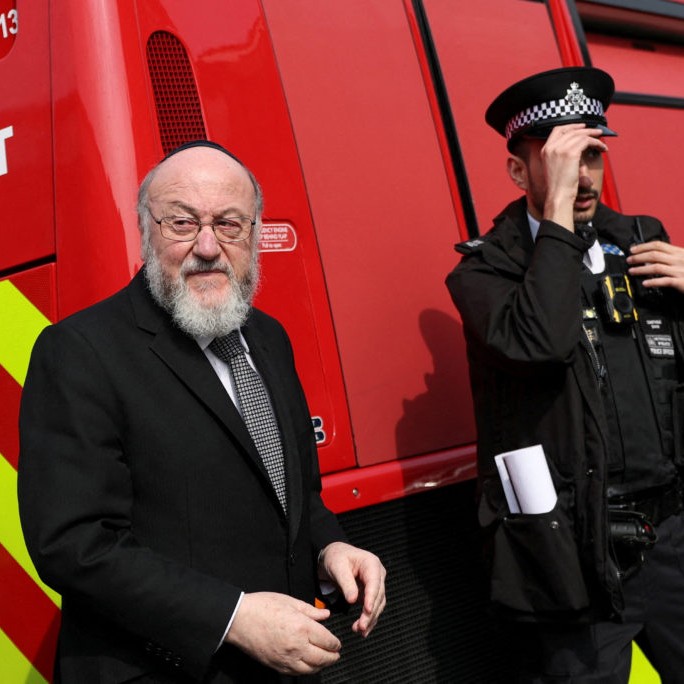 FILE PHOTO: Chief Rabbi Ephraim Mirvis visits the scene after four ambulances belonging to Hatzola, a Jewish community organisation, were set on fire in an incident that the police say is being treated as an antisemitic hate crime, in northwest London, Britain, March 23, 2026. Photo by Hannah McKay/File Photo/Reuters. - Hannah McKay/Reuters