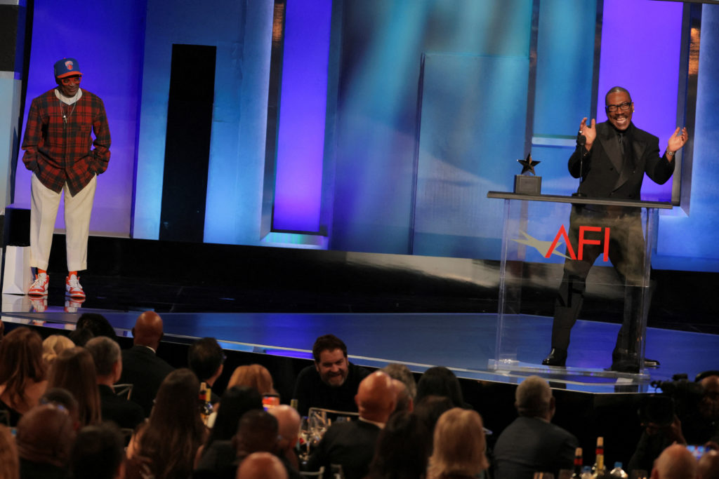 Spike Lee and Eddie Murphy react on stage during the 51st AFI Life Achievement Award tribute gala at the Dolby Theatre on April 18, 2026.