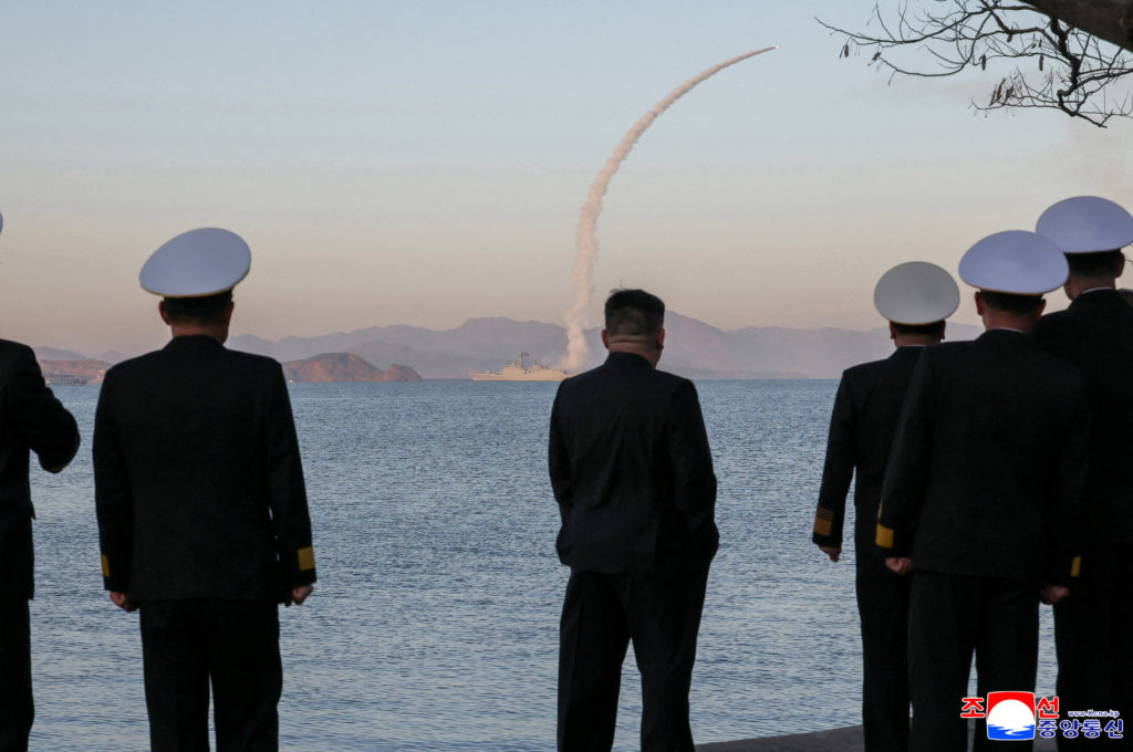 Kim Jong Un watches a test-fire of cruise and anti-ship missiles from a North Korean destroyer, in a KCNA photo via Reuters.