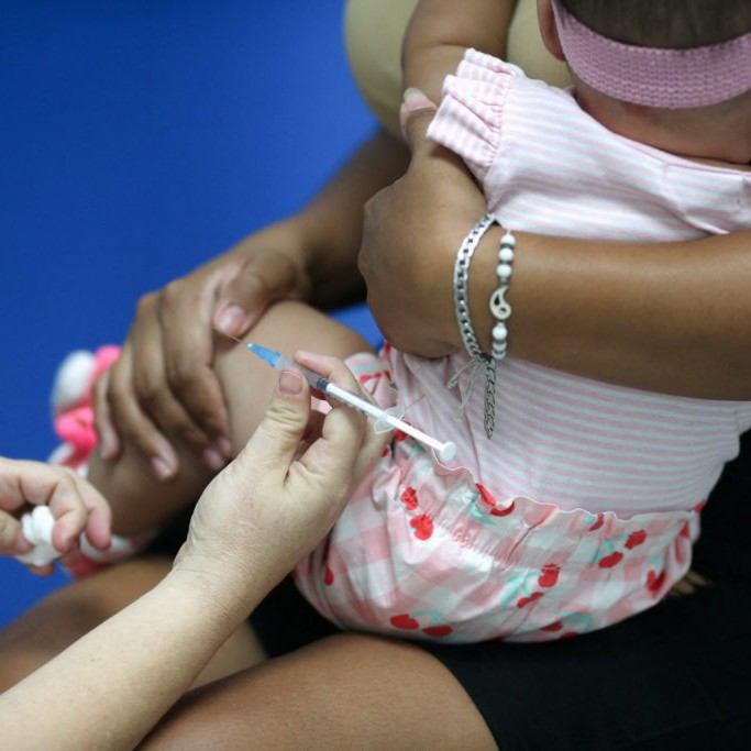 Left: Genesis Ariana Jimenez receives a measles vaccine at a government health center amid a vaccination campaign, in Nejapa, El Salvador April 10, 2026. Photo by Jose Cabezas/Reuters - Jose Cabezas/Reuters